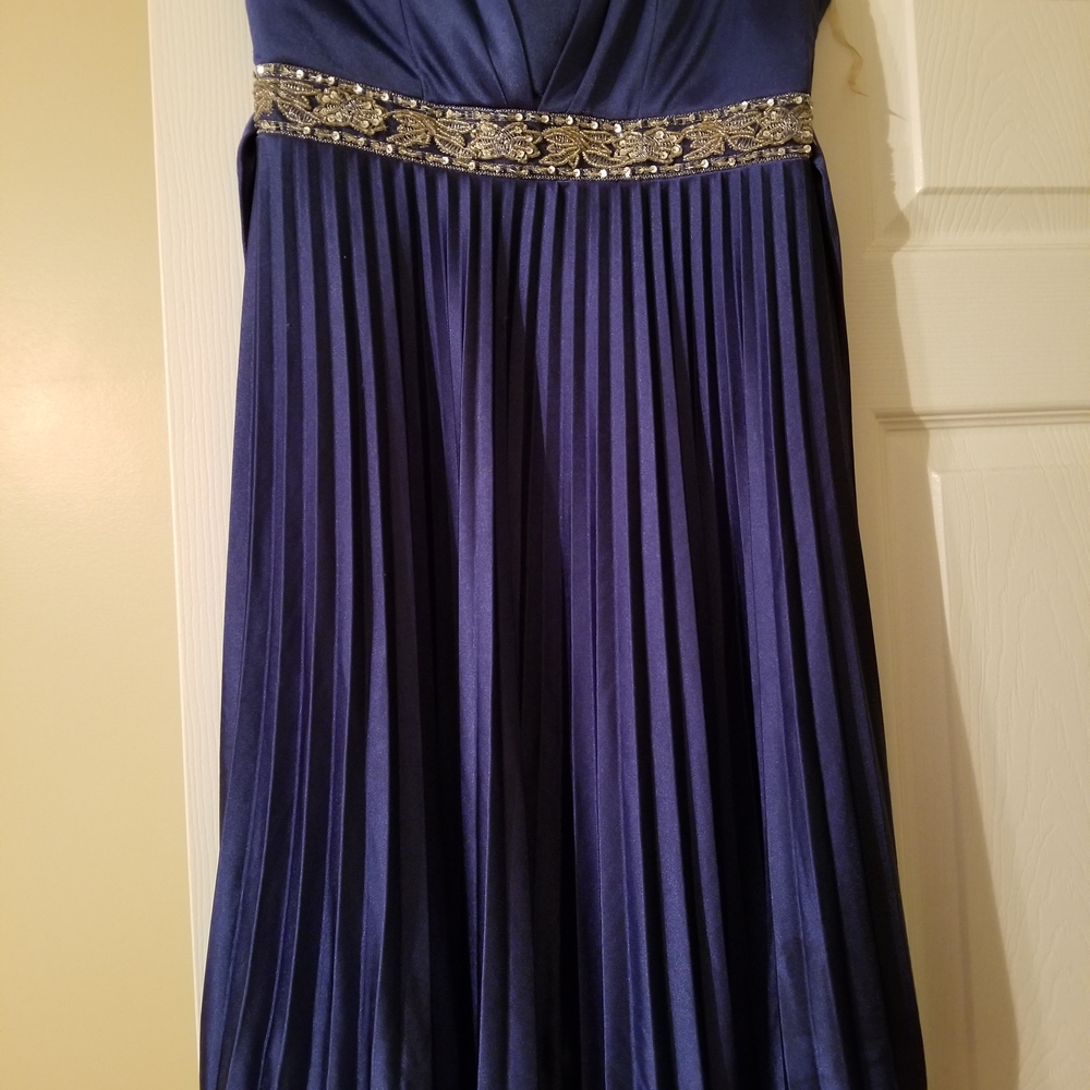 Elegant Blue Pleated Gown with Embellished Waist